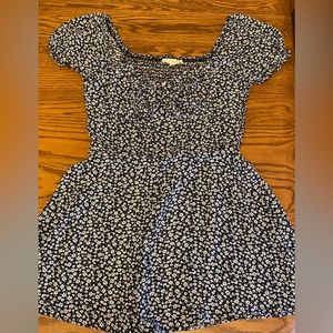 This is a black and white flower pattern romper